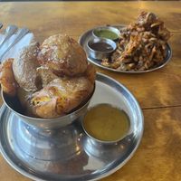 Potatoes and curry sauce  at Manjit's Kitchen in Leeds