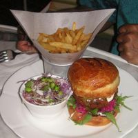 Falafel burger with side salad and chips at Botanical in Kuala Lumpur