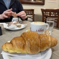 Vegan croissant with soia cappuccino.   at Pasticceria Nannini Conca D'Oro in Siena
