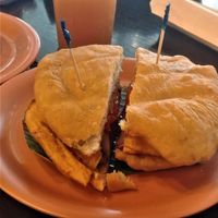 El Vegano in Hojaldre (sandwich) - Hojaldre with sweet plantain (tajada), black beans, grilled carrots & tomatoes & pickled onion at El Trapiche - Albrook Mall in Panama City