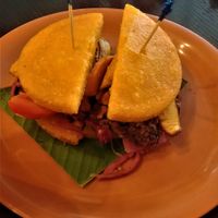 El Vegano in Corn Tortilla  (sandwich) - Corn Tortilla with sweet plantain (tajada), black beans, grilled carrots & tomatoes & pickled onion at El Trapiche - Albrook Mall in Panama City