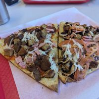 Vegan meatzza on the right and Vegan BBQ chicken on the right at Bizza in San Mateo