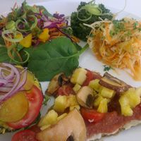 mixed plate including pizza slice and burger at Pure on Raw in Sheffield