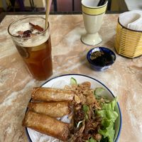 Noodles with spring rolls/orange cinnamon tea  at The Garden Cafe & Vegetarian Food in Hue