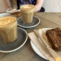 Oat coffee and vegan banana bread (toasted). Warning - they do give butter with it, but not actually on it.   at Fred & Ginger Coffee in Berkhamsted