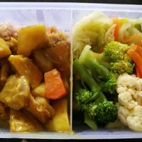 takeout bento box with rice, curry, and veggies. at Yunong Vegetarian - 語穠素食 in Hualien