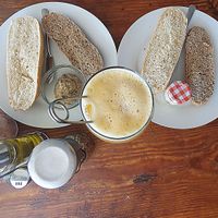 ginger -  lemon fresh juice and variety of vegan pate for breakfast at The Hangover Corner in Ibiza
