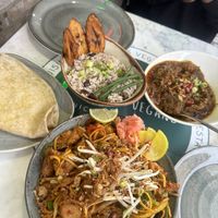 Vegan curry goat, plantain, rice and peas and roti, plus vegan chicken szechuan noodles   at Meat The Vegans in North West London