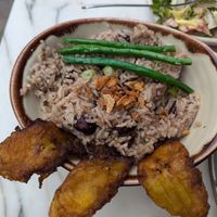 Rice with fried plantain at Meat The Vegans in North West London