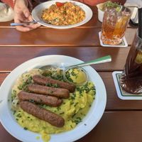Rostbratwürstl mit Sauerkraut
und Kartoffelpürree  at Mathilda Vegan in Munich