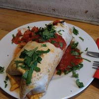 Vegan Burrito with potatoes, beans, guacamole, tomatoes and coriander and at Kombuse in Hamburg