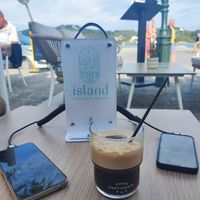 Charge your phone while wait at island cafe in Skiathos
