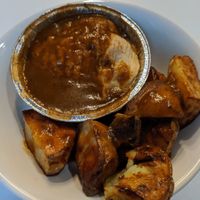 Mushroom pie with gravy and roasted potatoes at World Peace Cafe in Manchester