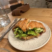 Split croissant filled with tempeh  at Booch Cafe in Riga