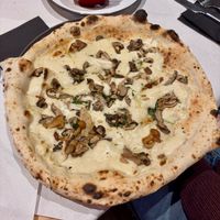 Porcina - white base, Casadei vegan mozzarella, premium porcini mushrooms, chanterelles, sauteed chestnut mushrooms, truffle olive oil & ground hazelnuts at Corte Campana in Stratford-upon-avon