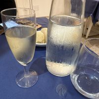 Prosecco and warm, fresh breadd  at Due Pistacchi Restaurant in Catania
