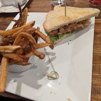 Picture of half of a tempeh BLT and some fries that are orange. at Root'd Cafe in Cottonwood Heights