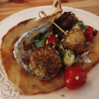 Courgette fritters, dille creme, geroosterde tomaat, komkommer, platbrood at Café Lief  in Haarlem