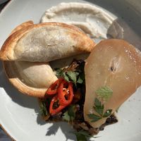 Two different type of empanadas with poached pear and chutney   at Café Lief  in Haarlem