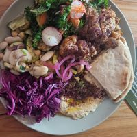 Large plate with roasted cauliflower, garlic hummus and 3 salads at Time for Mezze in Chorley