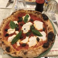 Vegan margherita pizza with added olives   at Pizzium in Bologna