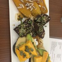 Ginger caramelised pumpkin, soy yam, and eggplant with hummus, avocado and papaya on top  at Cafe Nature's Blessing in Mysore
