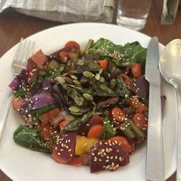 Spinach and shiitake on a bed of fresh vegetables and underneath rice noodles with a very soft balsamico sesame sauce  at Cafe Nature's Blessing in Mysore