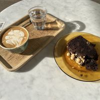 oat milk flat white & choco-banana cake  at Simona Specialty Coffee Club in San Sebastian