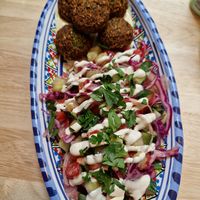 Falafel salad with hummus, tahini and parsley at FLFL - Den Haag  in The Hague
