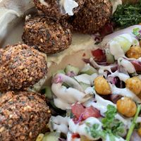All the hummus in the falafel salad  at FLFL - Den Haag  in The Hague