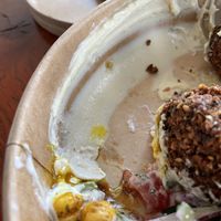 Another picture of all the hummus that is added to the falafel salad (falafel put aside for this picture)  at FLFL - Den Haag  in The Hague