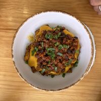Fully loaded potatoes with red bean chili  at Nanita in Oaxaca