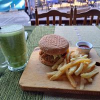 Vegan falafel burger with humous, spicy sauce and green smoothie at MIDO'S in Chefchaouen