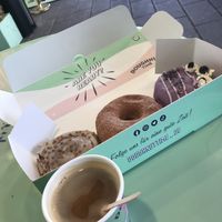 Coffee with oatmilk. Nr 1 apple pie flavour, nr 2 regular sugar doughnut, nr 3 blueberry cheesecake flavour.   at Doughnut Time in Berlin