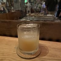 Peach wine with huge ice cube 🧊   at Kokoka Used Book Shop Cafe & Bar - ココカ古書店 本とたいやき in Tamano