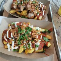 Up is non vegan Currywurst option, below is the vegan option at Frittenwerk - Mall of Berlin in Berlin