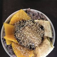 Black rice and coconut milk dessert topped with mango, banana, toasted sesame seeds and tamarind jam   at Tamarind - A Taste of Laos in Luang Prabang
