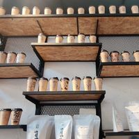 Coffee bags and decorated coffee cups at Qahwa BLK - Abdali Boulevard in Amman