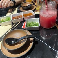 garlic, spring onion, sesame sauce, satay sauce, corianderand watermelon juice  at Crown Hot Pot in Leeds