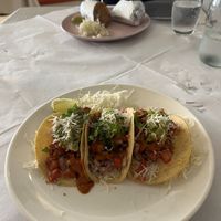 Vegan tacos with burrito in the background   at Indo Mexicano in Bugibba