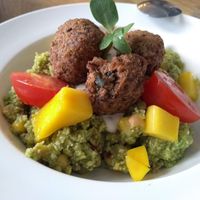 Mexican falafel bowl: the bottom is raw cauliflower cous cous and the yellow chunks are actually fresh mango!
 at MiiT in Riga