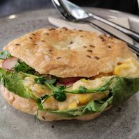 Chickpea and corn sandwich in a crunchy bagel bun at VíK - Vegan Venue in Bratislava