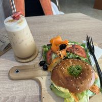 Tofu Bagel and iced Lavender latte  at VíK - Vegan Venue in Bratislava