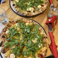 Vegan pizza (with the most incredible vegan cheese) and veggie pizza, pictured behind. at Innocent Cafe in Riga
