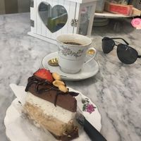 Peanut chocolate cake and Americano coffee at Simply Raw Bakery and Bistro in Vienna