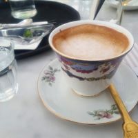 Coffee with housemade almond milk at Simply Raw Bakery and Bistro in Vienna