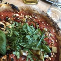 Veggie pizza no cheese with roasted garlic, aubergine, mushrooms and tapenade. Rocket on the top. Absolutely gorgeous  at Pizzerija Minutka in Postojna