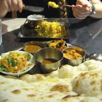 Upper one: rice dish, lower one: lunch set including three curries, a soup, salad and Naan. October 2015 at Vege Herb Saga in Tokyo