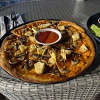 Pizza with pineapple and mushrooms  at Soley Bar in Kuta