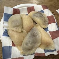 Nutella pierogi (dark interior) and carrot/peanut pierogi (orange interior)  at Pierożak Pierogarnia  in Poznan